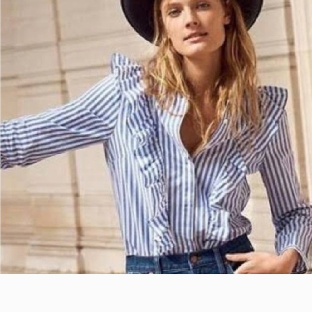 Madewell Striped Ruffle-Front Blouse in blue and white. It features long sleeves